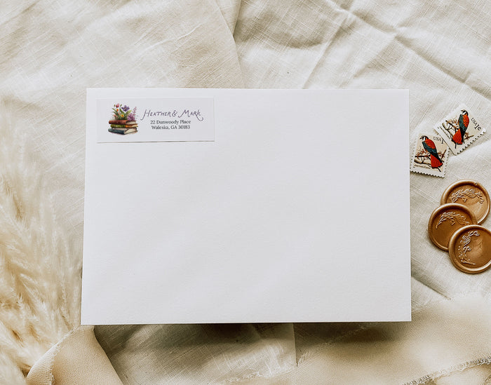 White envelope with address label on a textured beige surface